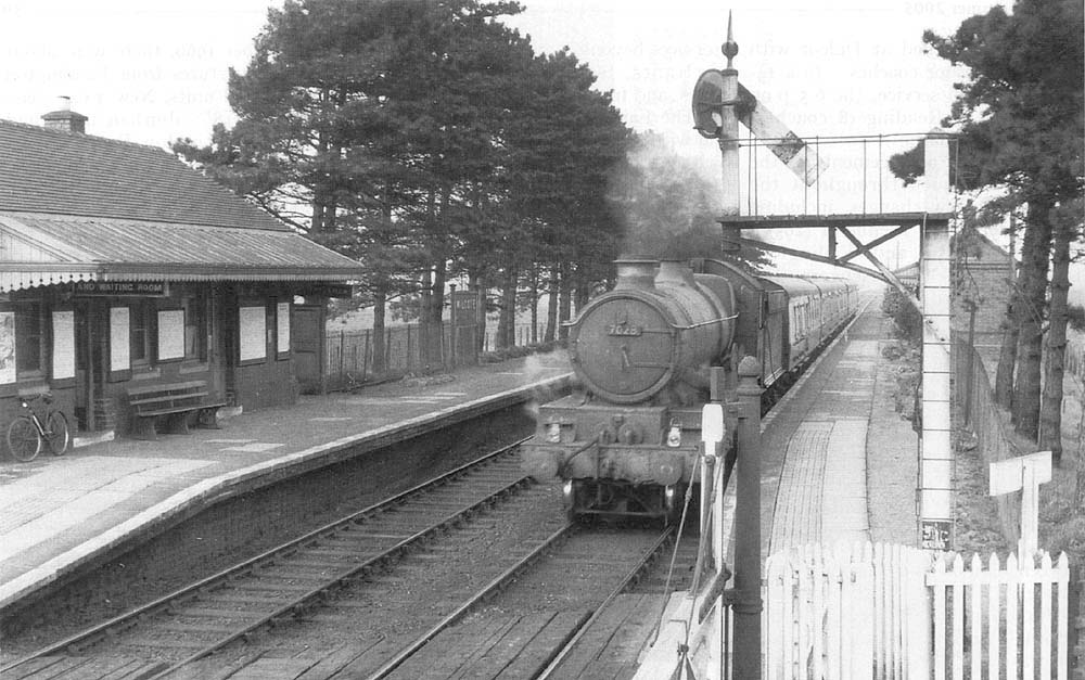 British Railways built 4-6-0 Castle class No 7028 'Cadbury Castle' is seen passing through the station on 3:45pm Snow Hill to Swansea service