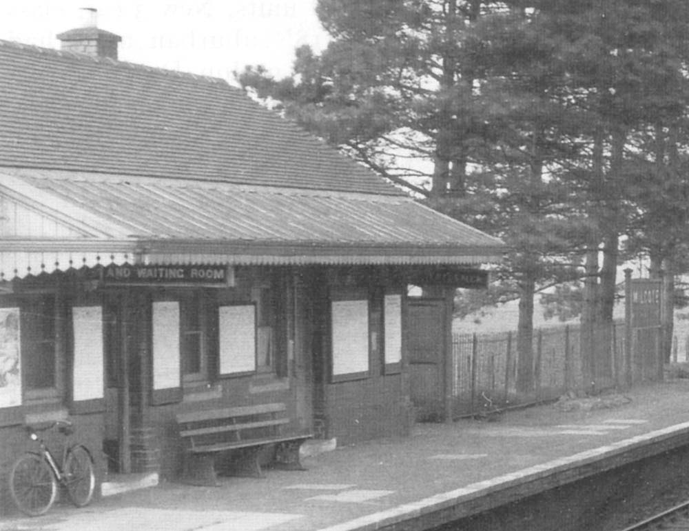 Close up showing the main station building on the down platform with the booking office on the left and gentlemen's toilets on the right