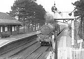 British Railways built GWR 4-6-0 Castle class No 7028 'Cadbury Castle' is seen passing through the station on 3:45pm Snow Hill to Swansea service
