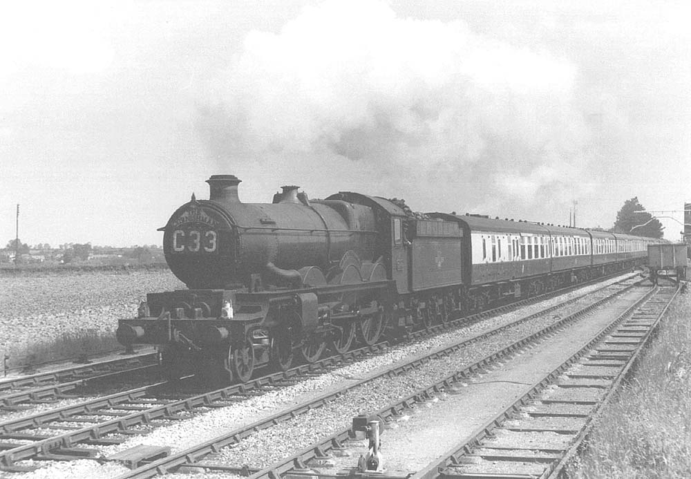 Ex-GWR 4-6-0 No 5046 'Earl Cawdor' heads the Down 'Cornishman' past Milcote station's sidings on 31st May 1961