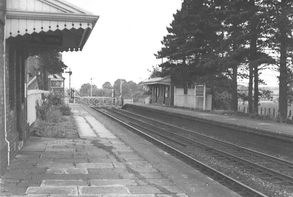 Looking south along the down platform towards Honeybourne and Milcote Signal Box and level crossing with up waiting room on the right