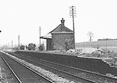 Close up showing the now abandoned down platform and Waiting Room at Milcote station
