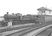 Ex-GWR 2-6-0 No 6340 is seen at the head of a parcels train as it passess from the down relief life line on to the down main line