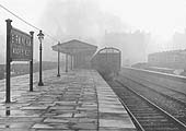 On a wet June day in 1911 a Steam Railcar waits at the island platform at Moor Street Station