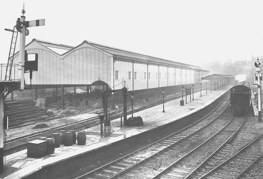 View of Moor Street station and the high level goods shed with a suburban passenger train leaving the short bay platform No1