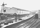 Moor Street station and the high level goods shed with a suburban passenger train leaving the bay platform No1