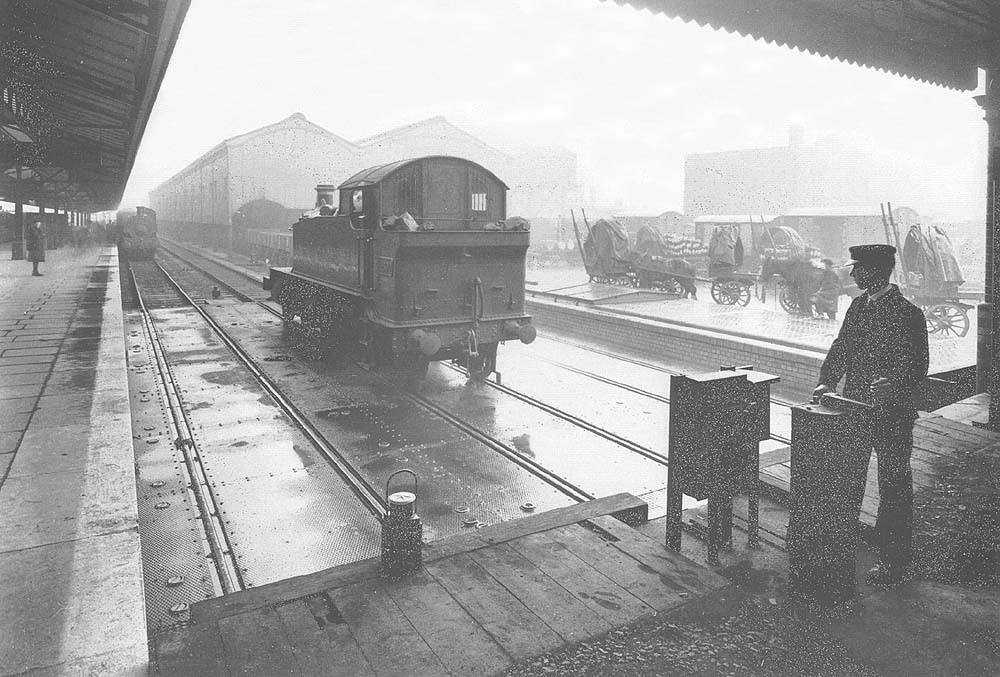 Great Western Railway 4-4-2T No 4600 on the middle road of the traverser table being transferred to the loop line from the line serving island platform No 3