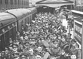 Territorials from the Royal Warwickshire Regiment board GWR coaches assembled to form a troop train