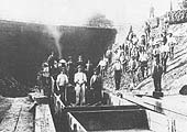 View of the construction crew working on removing the original Moreton-in-Marsh tramway tunnel which passed under Camden Road