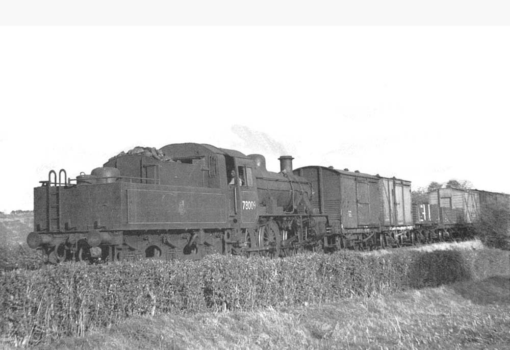 British Railways Standard Class 2 2-6-0 Mogul No 78009 is seen approaching Stretton Fosse with a Shipston bound freight 6 Oct 1953