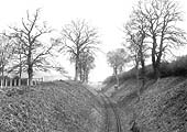 View of the cutting within which the branch line ran having crossed the Lodenham Road level  crossing with the Fosse Way on the extreme left
