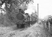 GWR 0-6-0 'Dean Goods' No 2551 approaches the Moreton to Todenham Roadd level crossing 4 September 1948