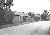 A closer view of the stone building once used by the tramway at Ilmington Wharfe with the level crossing on the left