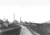 Looking along the course of the tramway approaching the river bridge, with the saw mill in the distance