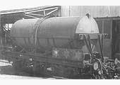 A six-wheel milk tank wagon stands in the siding alongside the Creamery with milk churns in the goods bay