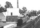 Close up of three empty Great Western Railway Siphons standing in Moreton-in-Marsh's creamery