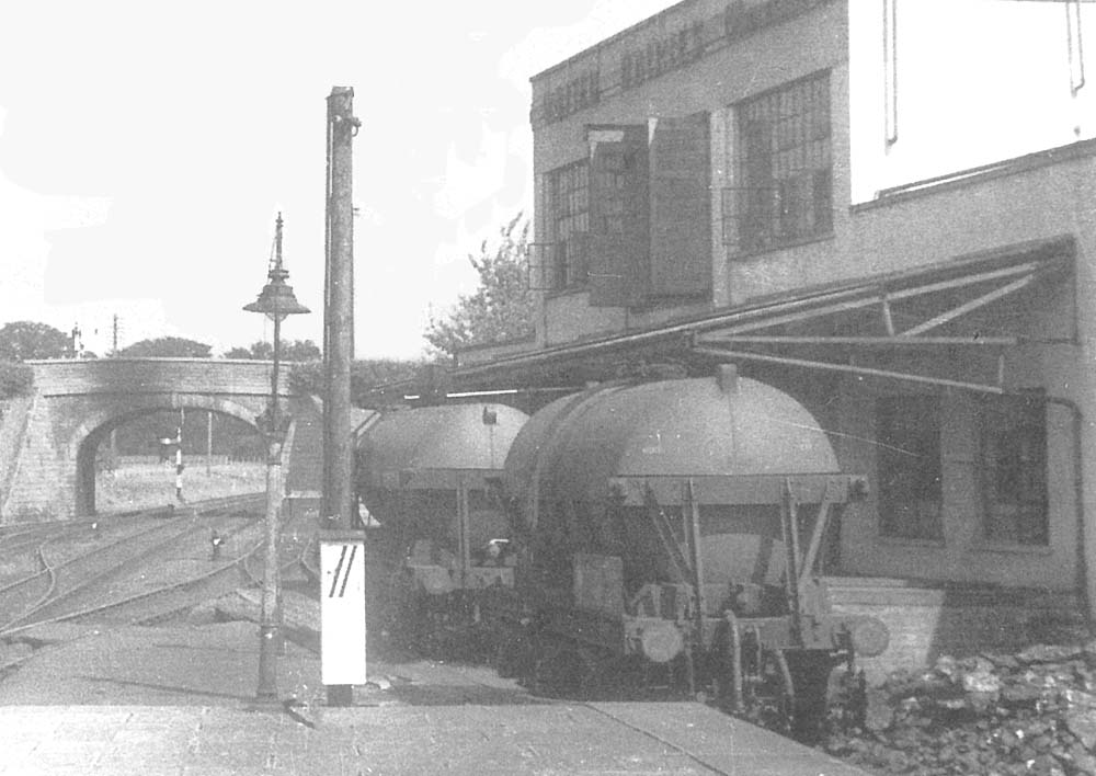 Two empty Milk tank wagons standing in the siding of Moreton-in-Marsh's Creamery ready to be loaded