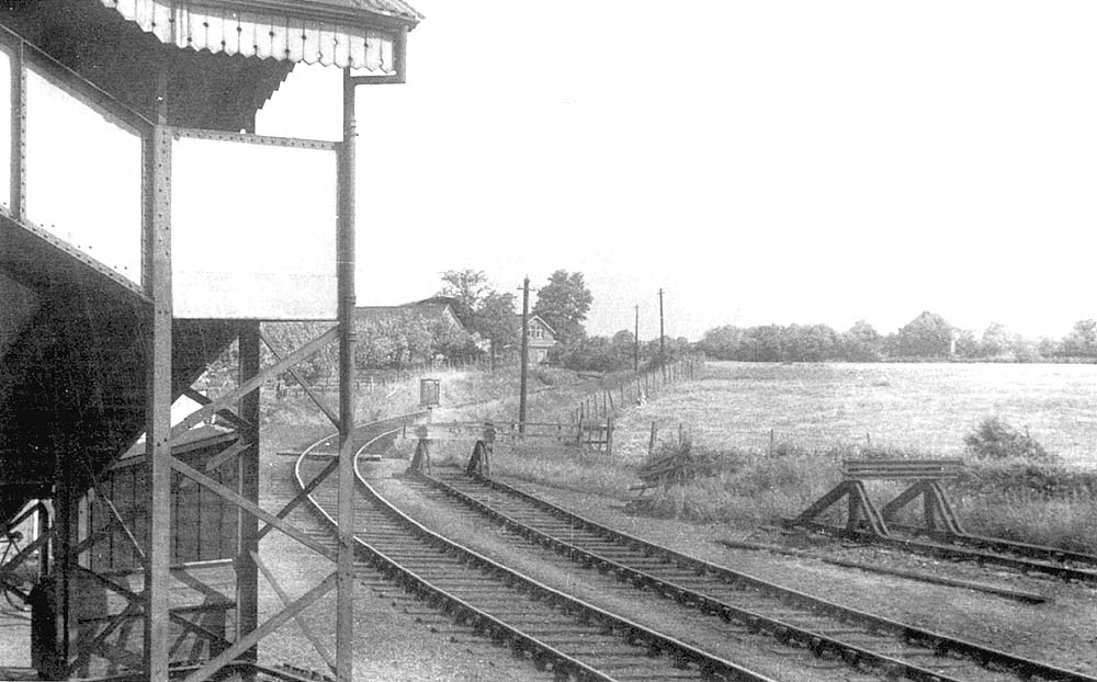 View of the branch line taken from the platform with Todenham Road level crossing keeper's house in distance