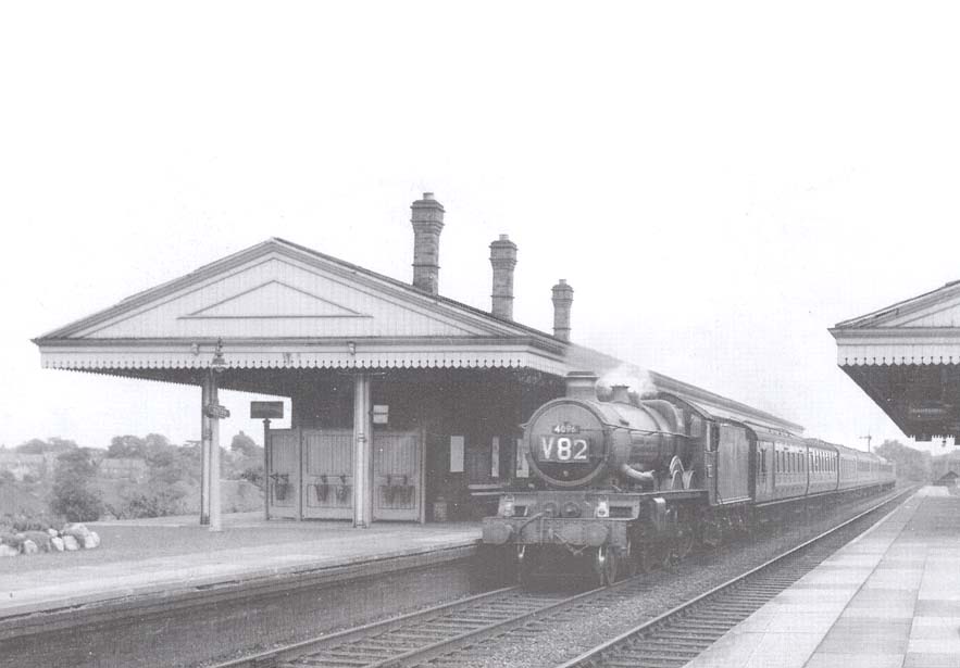 GWR 4-6-0 '4073 class' No 4096 'Highclere Castle' is seen heading a train of Southern Region coaching stock in August 1962