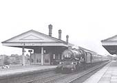 GWR 4-6-0 '4073 class' No 4096 'Highclere Castle' is seen heading a train of Southern Region coaching stock in August 1962