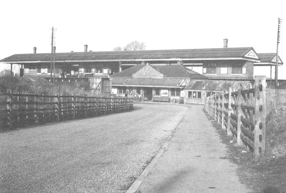 Looking from Ulverley Green Road along Station Drive towards Olton's new station's booking office with the two island platforms above