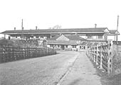 Looking from Ulverley Green Road along Station Drive towards Olton's new station's booking office with the two island platforms above
