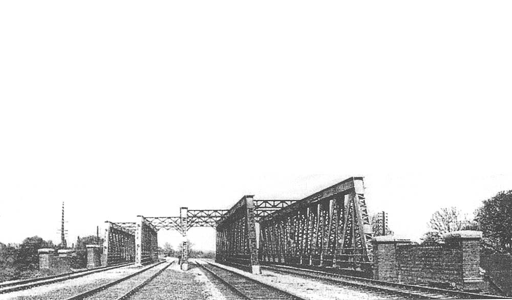 An official photograph of the four road braced framework girder bridge built to carry the GWR's new widened lines over the main Birmingham Road