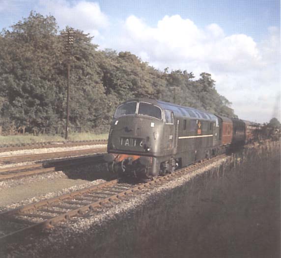 Warship D817 'Foxhound' is seen between Olton and Solihull on the 7:30am Shrewsbury to Paddington service on 27th August 1962