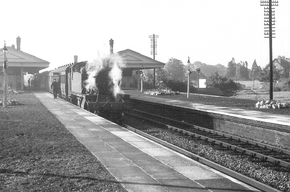 Ex-Great Western Railway 2-6-2T 5101 class No 5192 arrives at the Down Main platform of Olton Station at 8:22 a.m. on Monday 17th  August 1959
