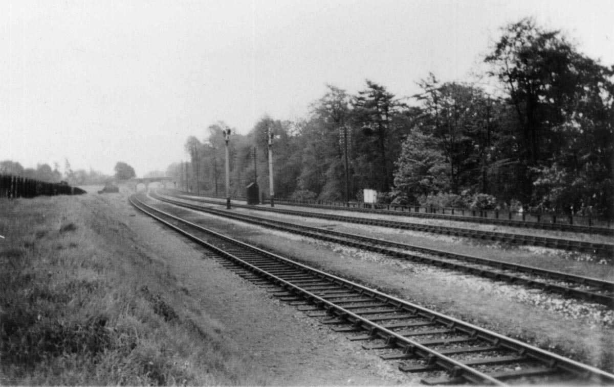 A view of the completed quadrupled track alongside Olton Mere looking towards Solihull. The location is near milepost 123�.
