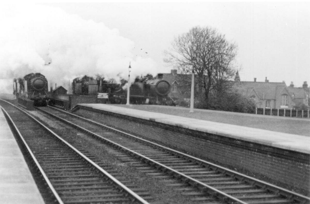 Two GWR 2-6-2T 3150 class Prairie Tanks Nos 3155 and 3163 each head a GWR 4-6-0 King class locomotive with another Prairie Tank at the rear