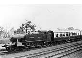 A GWR 2-6-2T 3150 class Prairie Tank hauls a two-coach service on the recently quadrupled track