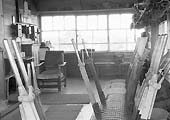 Another view showing the spartan interior of Queens Head Signal Box, with the telephone equipment on the back wall