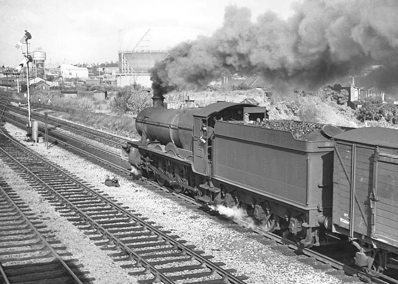 Another view of ex-GWR 68xx Class 4-6-0 No 6820 'Kingstone Grange' storming past Queens Head Signal Box on 19th September 1964