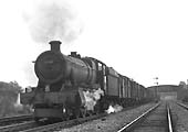 Ex-GWR 6959 Class 4-6-0 No 6980 'Llanrumney Hall' approaches Queens Head sidings with a down goods train