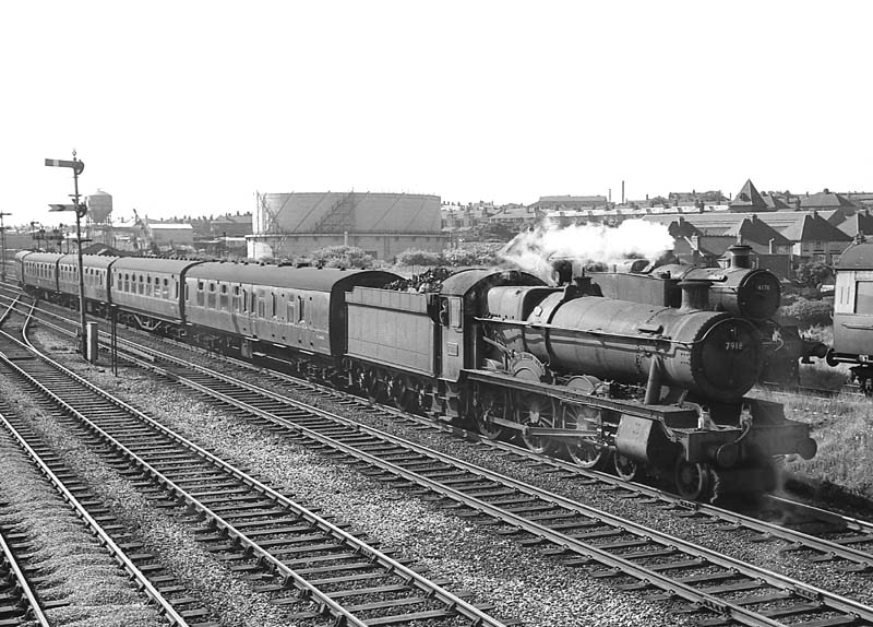 British Railways built 6959 Class 4-6-0 No 7918 'Rhose Wood Hall' works empty stock to Snow Hill on 3rd July 1964
