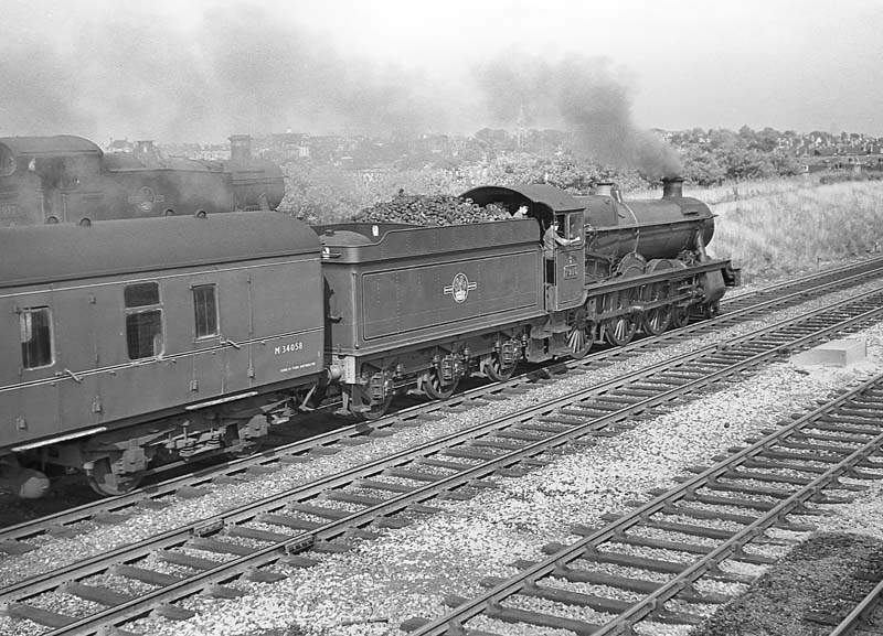 British Railways built 4-6-0 No 7915 'Mere Hall' leaves Queens Head with empty carriage stock for Snow Hill station on 16th July 1964