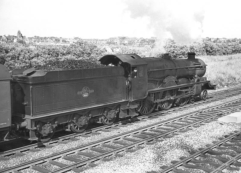 Ex-GWR Castle Class 4-6-0 No 5091 'Cleeve Abbey' is seen passing Queens Head sigings on 29th June 1964