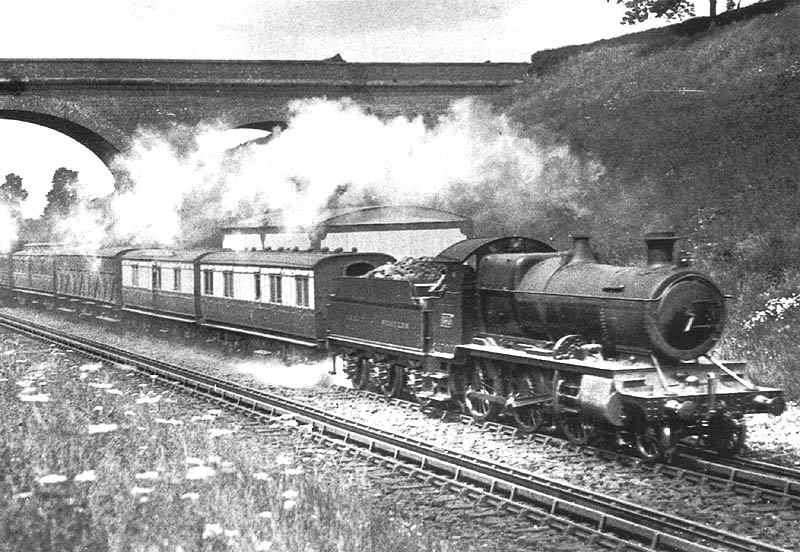 GWR 2-6-0 43xx class No 6314 is seen picking up water whilst at the head of an up Snow Hill to Oxford parcels service