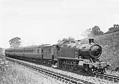 GWR 3150 Class 2-6-2T No 3186, with a horsebox behind the bunker, is seen passing over Rowington Troughs
