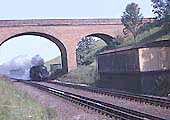 An unknown ex-LMS 4-6-0 Class 5 passes Rowington Troughs on a southbound passenger service on 17th July 1965