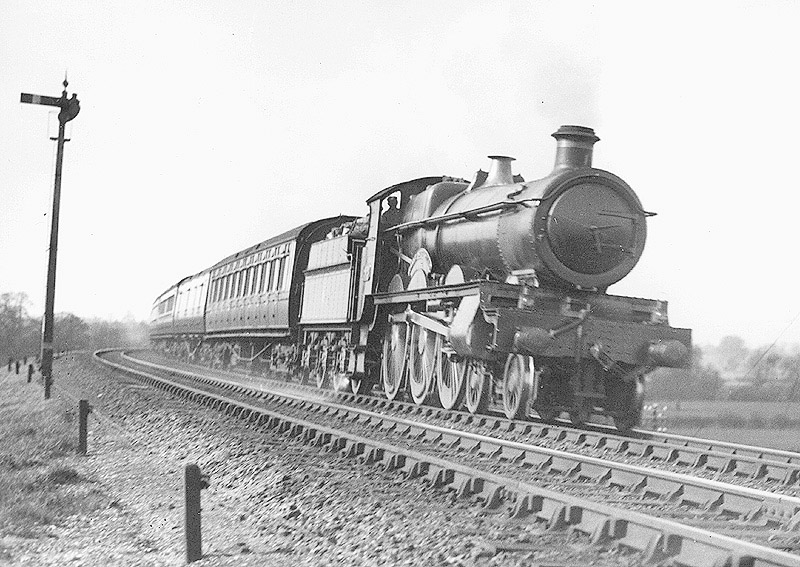 GWR 4-6-0 Saint class No 2928 'Saint Sebastian' is seen at the head of an up express having just taken on water at Rowington troughs