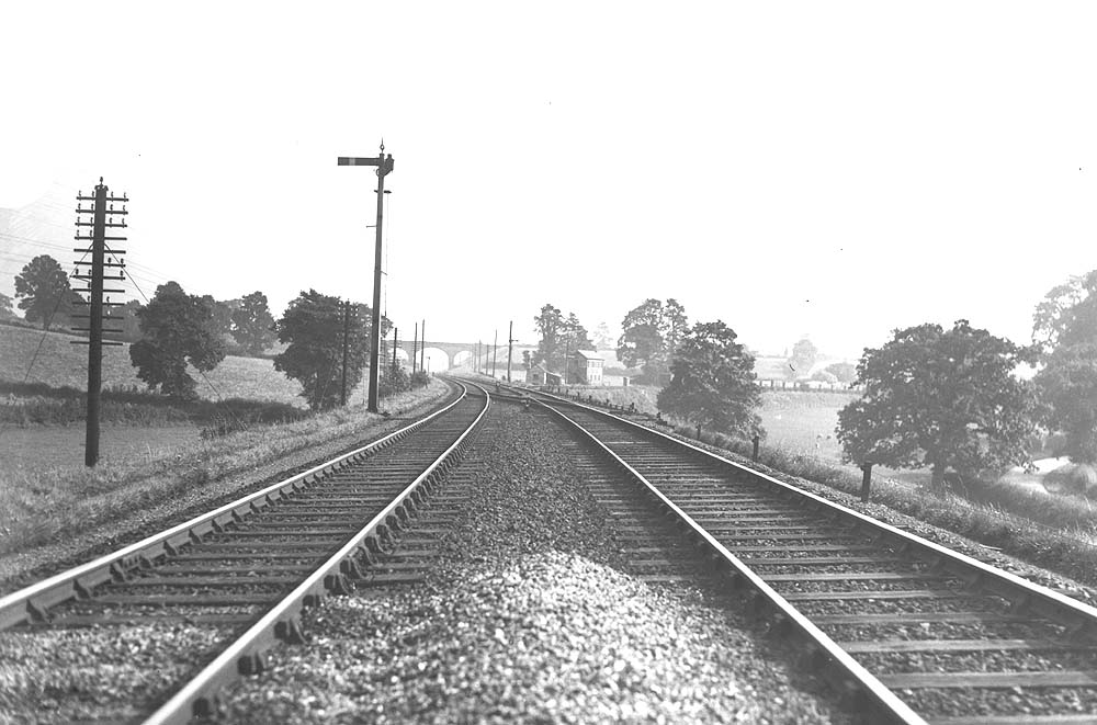 View of Rowington Junction looking towards Leamington Spa with the signal box controlling the branch to Henley in Arden 'old' station on the right