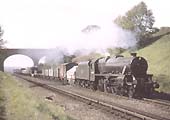 Ex-LMS 4-6-0 No 44810 is seen on a Class F working whilst picking up water at Rowington Troughs