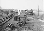 An unidentified ex-GWR 4-6-0 locomotive passes Rowington Junction with a southbound freight service on 3rd March 1961