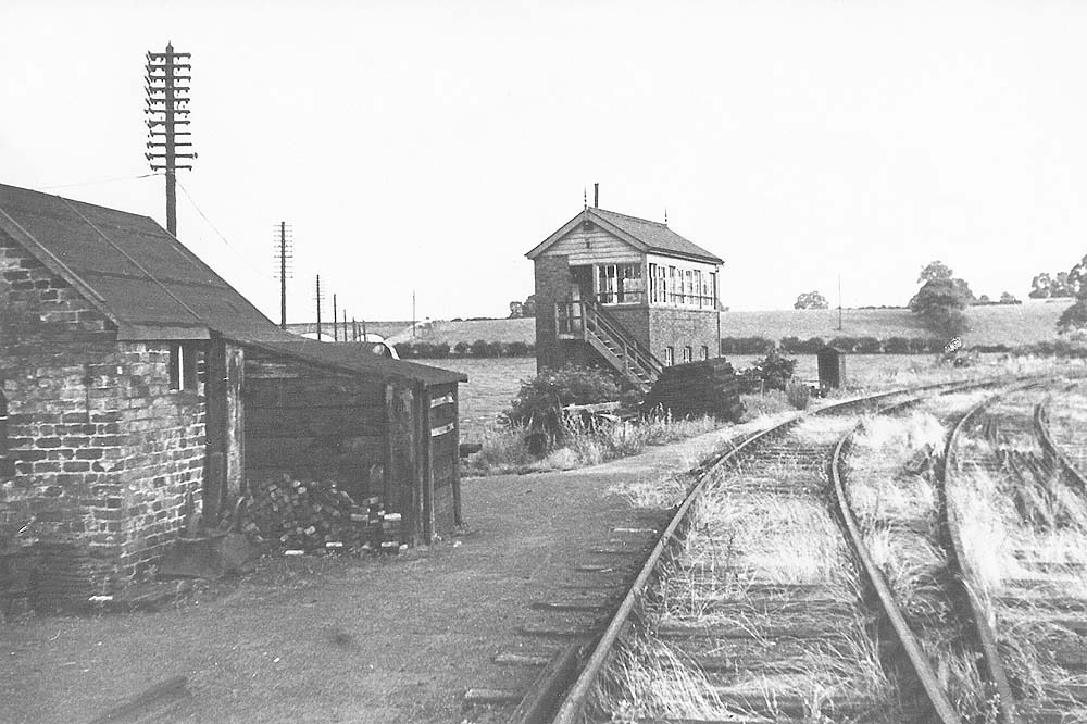 Looking along the branch towards Henley in Arden and Rowington Junction Signal Box with a PW hut on the left