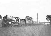 GWR 4-6-0 No 2924 'St Helena' is seen approaching Rowington Junction with an express service circa 1910