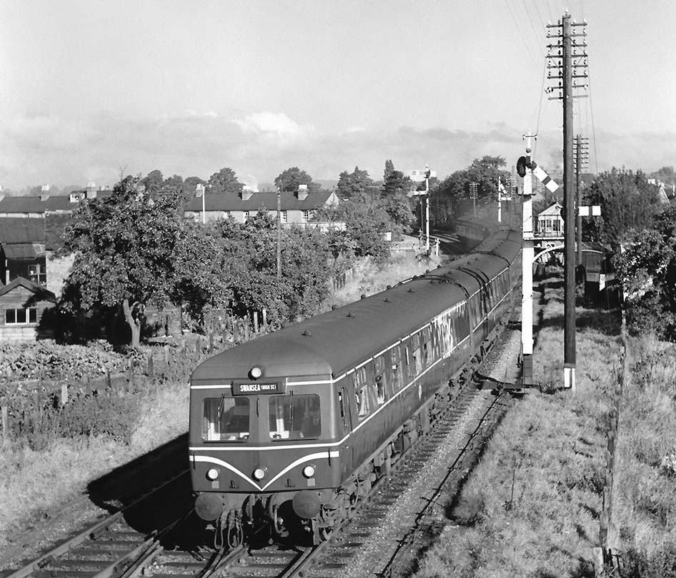 A Cross-Country nine-car DMU on the 09:00am Snow Hill to Swansea High Street service passes beneath Sanctus Road