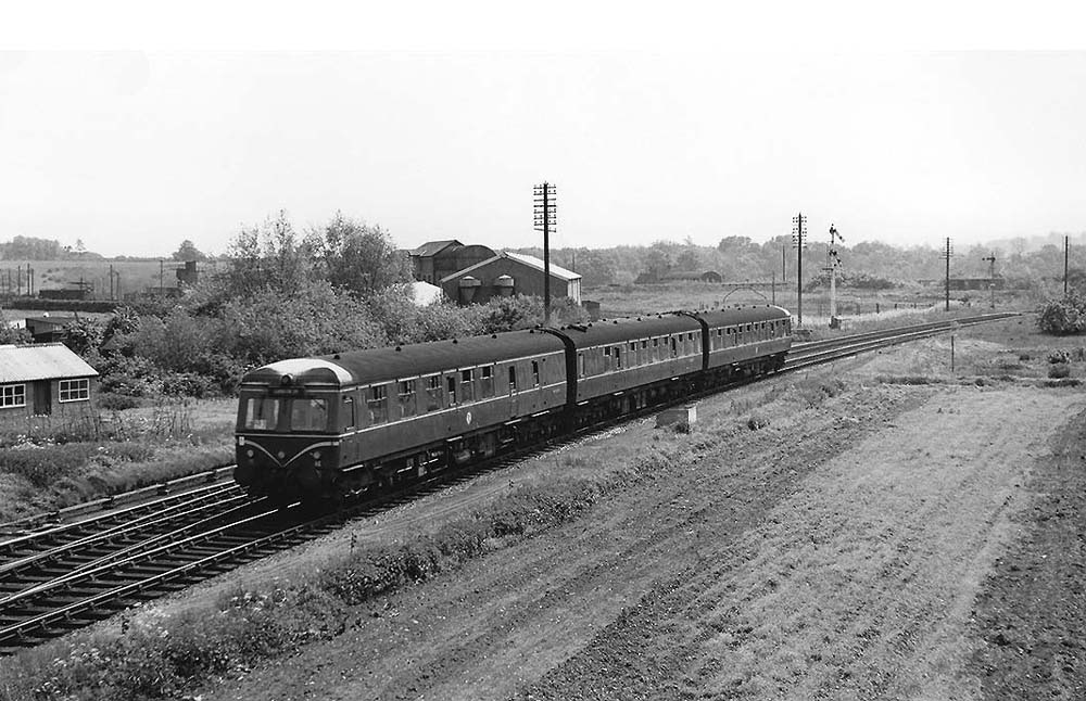 A three-car Swindon built Cross Country DMU passes the junction with the SMJ on the 13:25pm Worcester Shrub Hill to Leamington Spa service on 25th May 1963