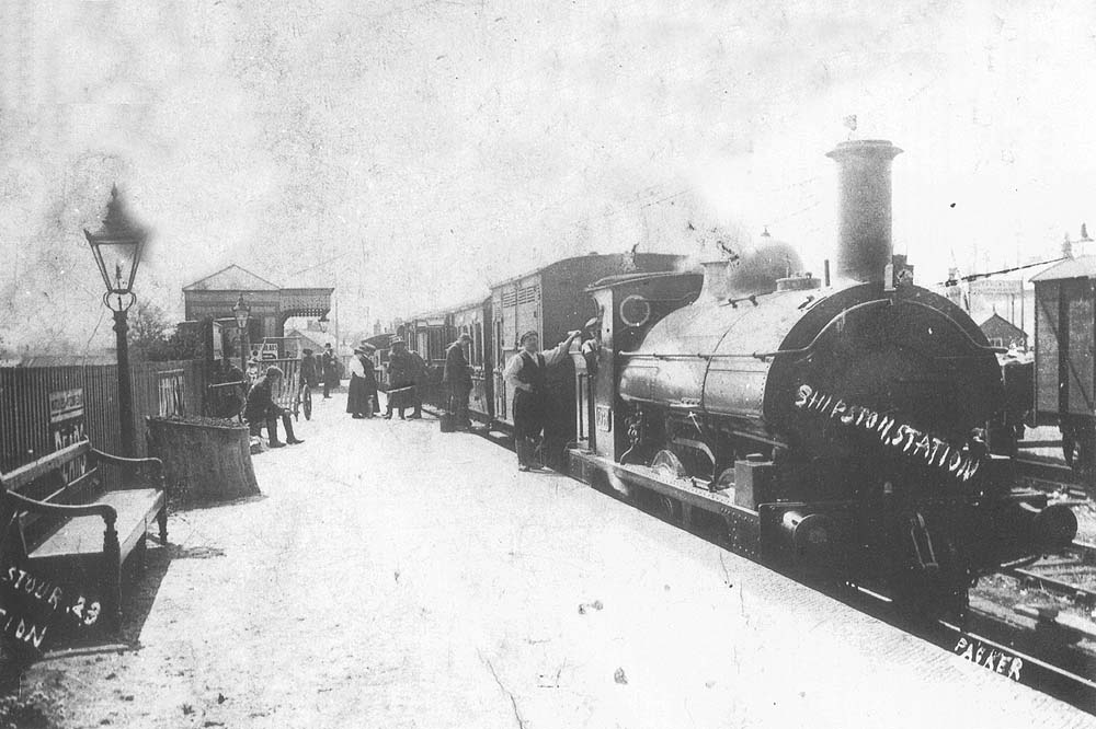 Edwardian view of a GWR 0-6-0ST at the head of a mixed local passenger service to Moreton in Marsh with local passengers and staff posed for the camera